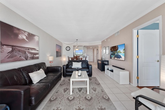 living area featuring light tile patterned floors, visible vents, and ornamental molding