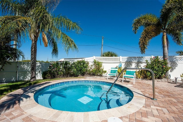 view of swimming pool featuring a patio area and a fenced backyard