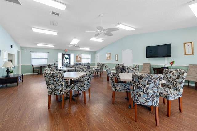 dining space featuring a wealth of natural light, visible vents, and wood finished floors