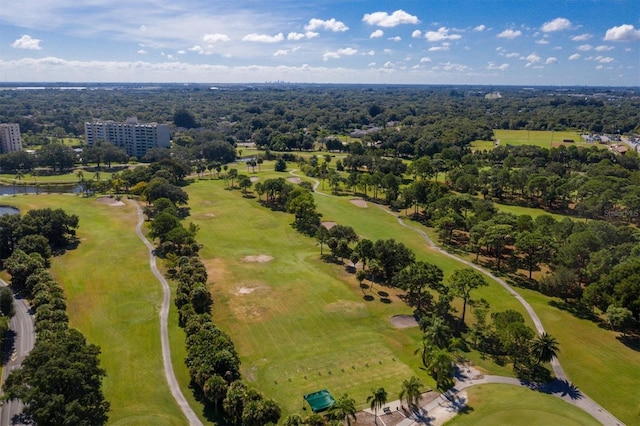 bird's eye view featuring a water view and view of golf course