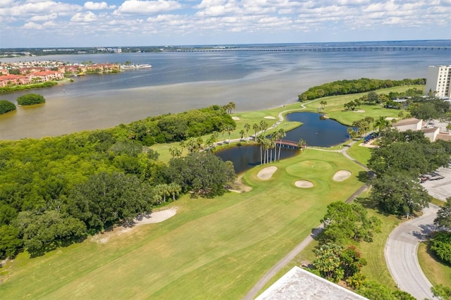 aerial view with view of golf course and a water view