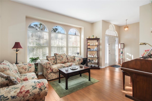 living room featuring wood finished floors and baseboards