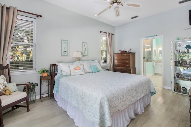 bedroom with light wood finished floors, a ceiling fan, visible vents, and baseboards