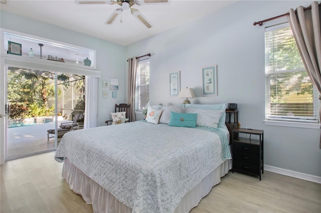 bedroom featuring light wood finished floors, access to outside, baseboards, and a ceiling fan