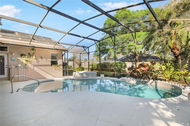 pool featuring a lanai and a patio area