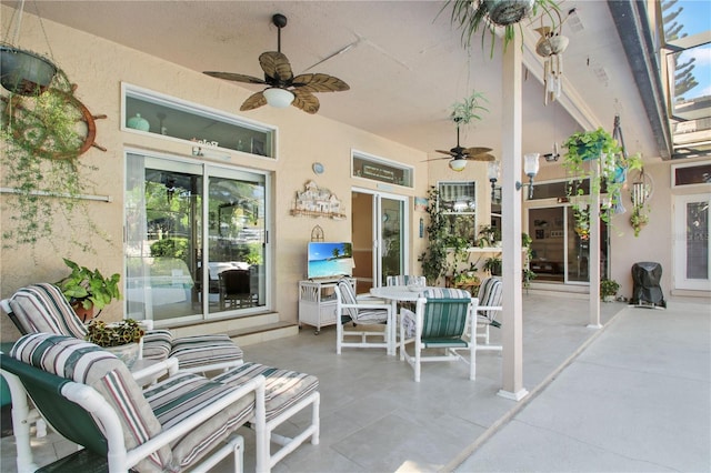 view of patio / terrace with outdoor dining area and ceiling fan