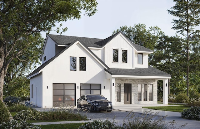 modern farmhouse style home featuring a garage, stone siding, driveway, and a porch