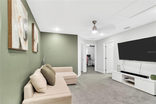 living area featuring carpet floors, recessed lighting, visible vents, and baseboards