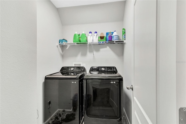 washroom featuring laundry area and independent washer and dryer