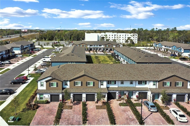 birds eye view of property with a residential view