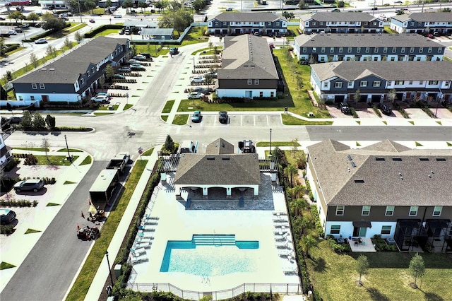 birds eye view of property with a residential view