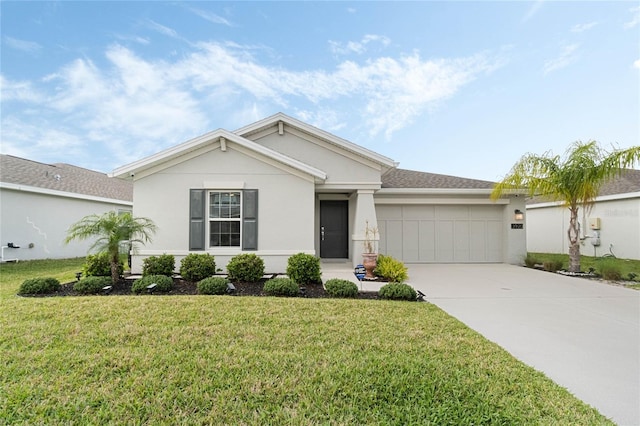 ranch-style home featuring a garage, driveway, a front yard, and stucco siding