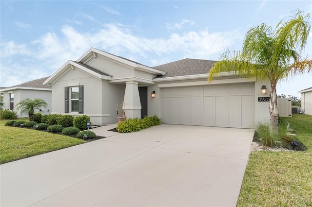 view of front of house featuring stucco siding, a shingled roof, concrete driveway, an attached garage, and a front lawn