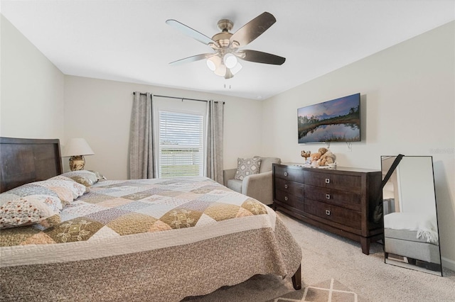 bedroom with a ceiling fan and carpet flooring