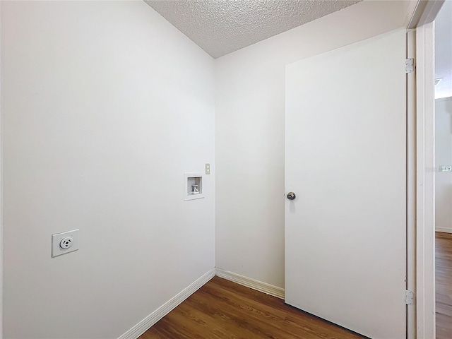 washroom with laundry area, wood finished floors, a textured ceiling, washer hookup, and electric dryer hookup