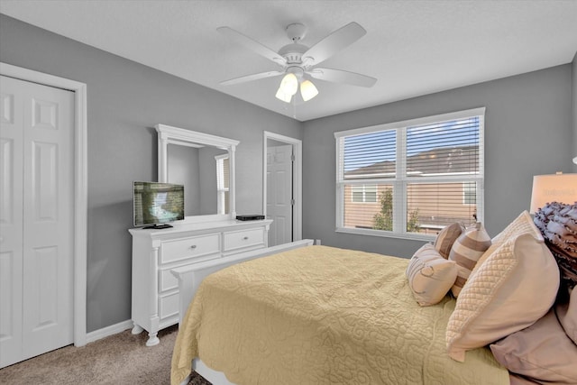 bedroom with light carpet, ceiling fan, and baseboards