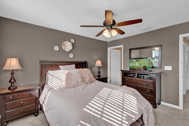 bedroom with carpet floors, visible vents, ceiling fan, and baseboards