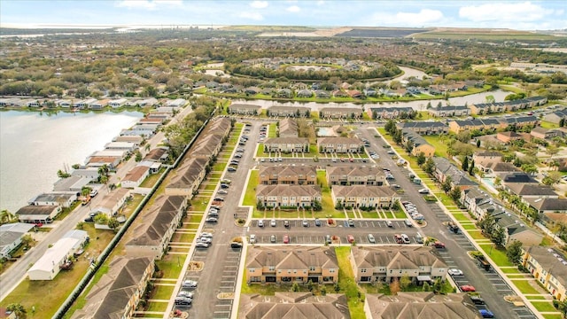 bird's eye view featuring a water view and a residential view