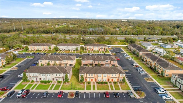 aerial view with a residential view and a wooded view