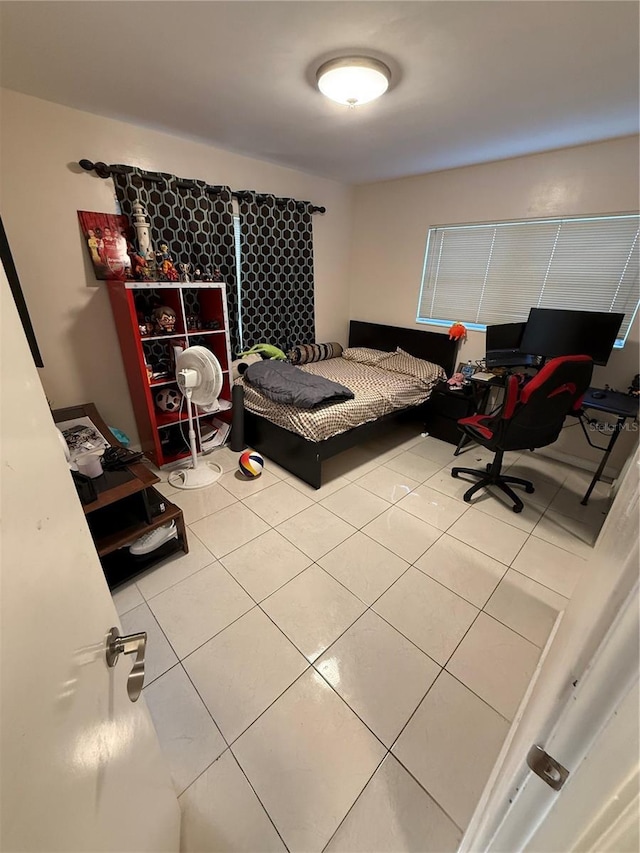 bedroom with tile patterned floors