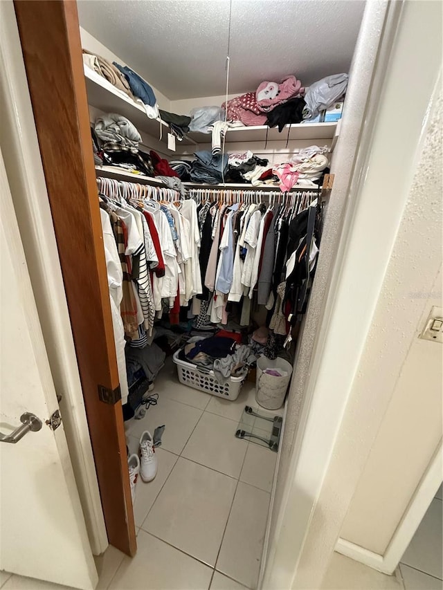 walk in closet featuring tile patterned floors