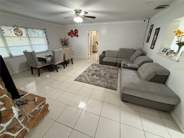 living room featuring a ceiling fan, visible vents, crown molding, and light tile patterned floors