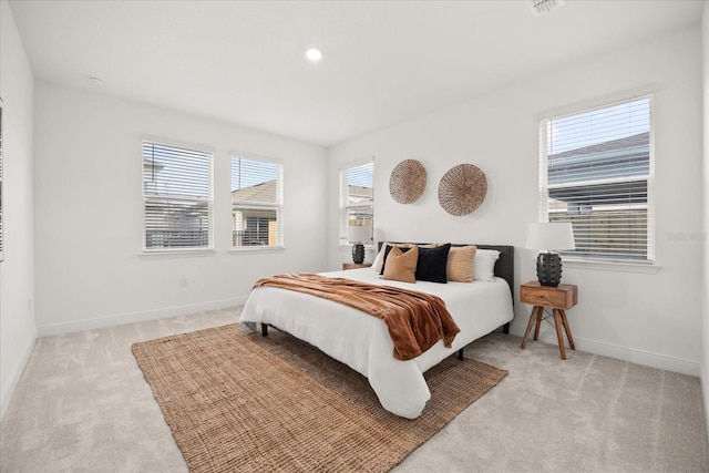 bedroom featuring recessed lighting, baseboards, and light colored carpet