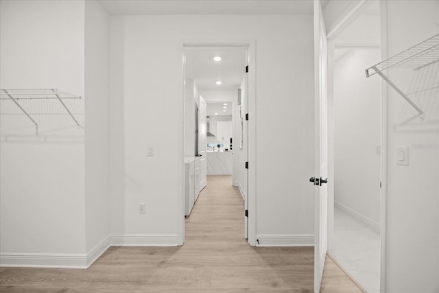 walk in closet featuring light wood finished floors