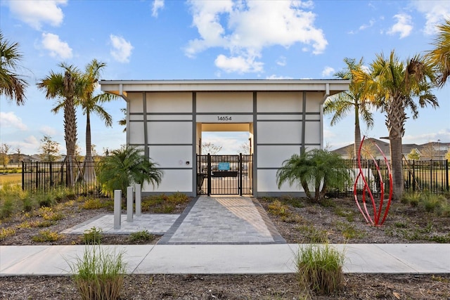 view of building exterior with fence