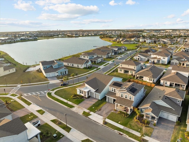 bird's eye view featuring a water view and a residential view