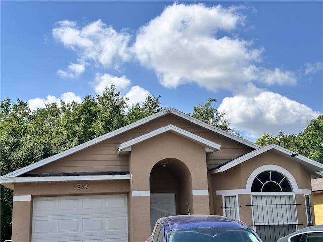 view of front of house featuring stucco siding