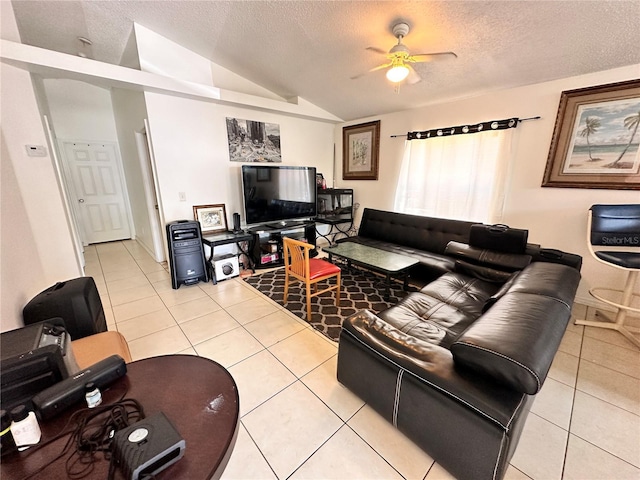 4954 Luna Negra Dr, Orlando, FL 32811 - living area featuring light tile patterned floors, a textured ceiling, vaulted ceiling, and a ceiling fan
