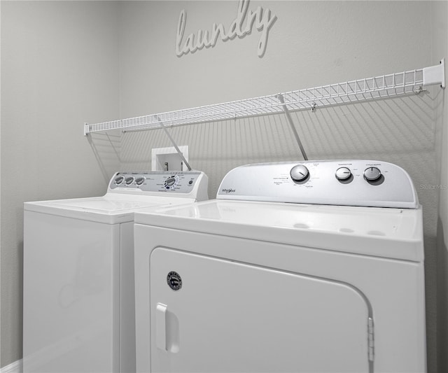 laundry room featuring laundry area and washing machine and clothes dryer