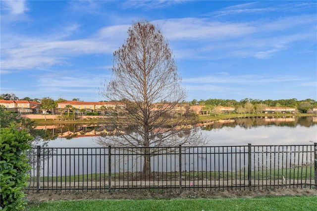 property view of water featuring fence