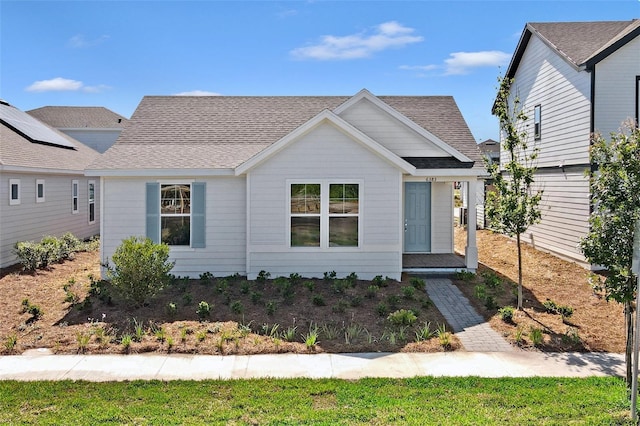 view of front of house featuring roof with shingles