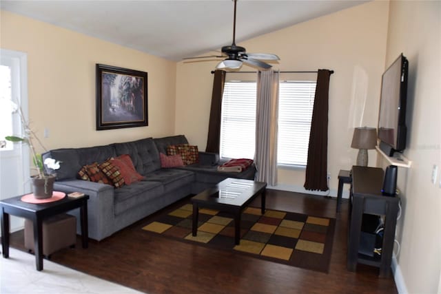 living area with lofted ceiling, wood finished floors, and a ceiling fan