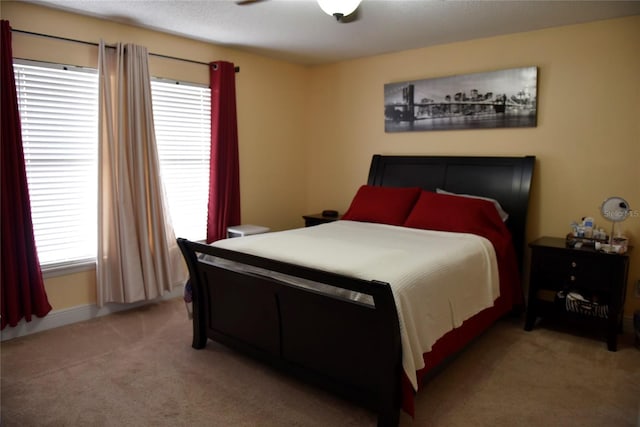 bedroom featuring light colored carpet