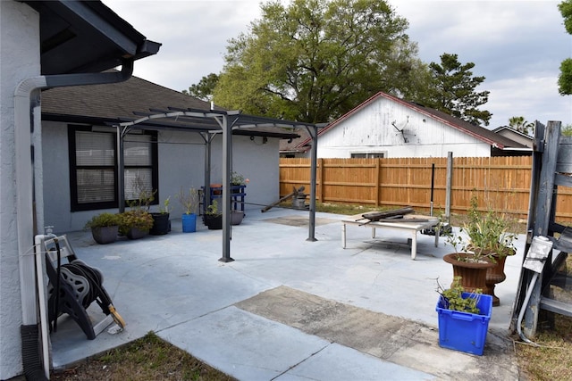 view of patio / terrace with a pergola and fence