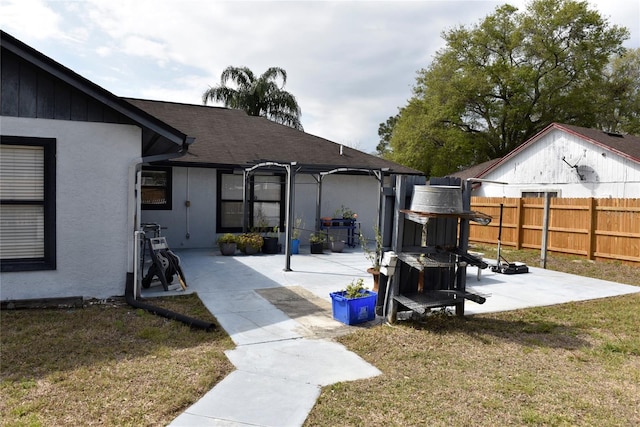 view of yard featuring a patio and fence