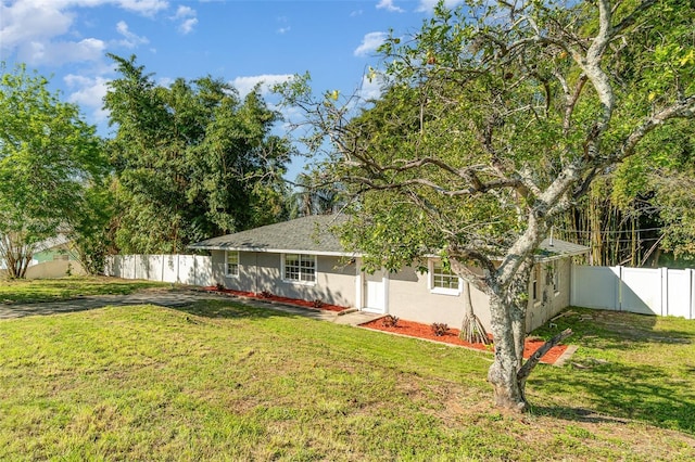 view of yard featuring a fenced backyard and a gate