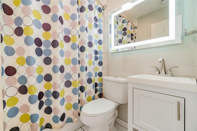 bathroom featuring vanity, toilet, and a shower with curtain