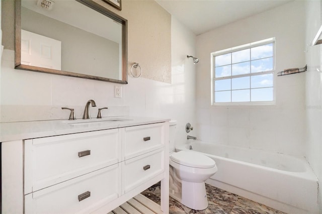 bathroom with visible vents, vanity, bathtub / shower combination, and toilet