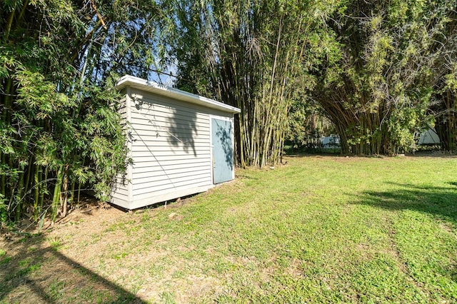 view of yard with an outbuilding and a storage shed