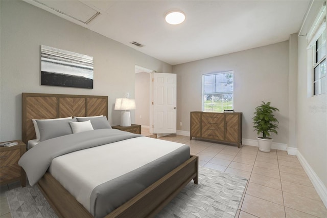 bedroom with light tile patterned floors, baseboards, and visible vents