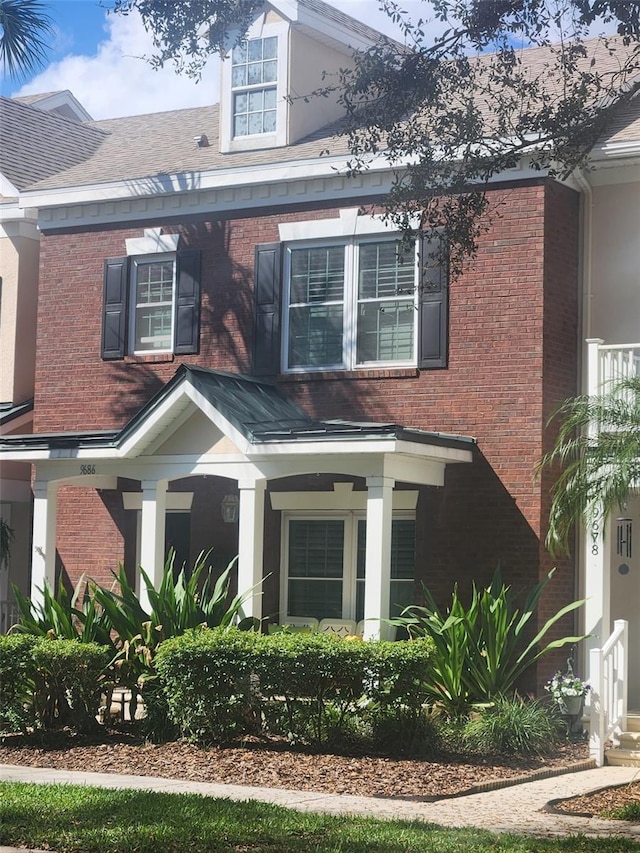 view of front of home with brick siding