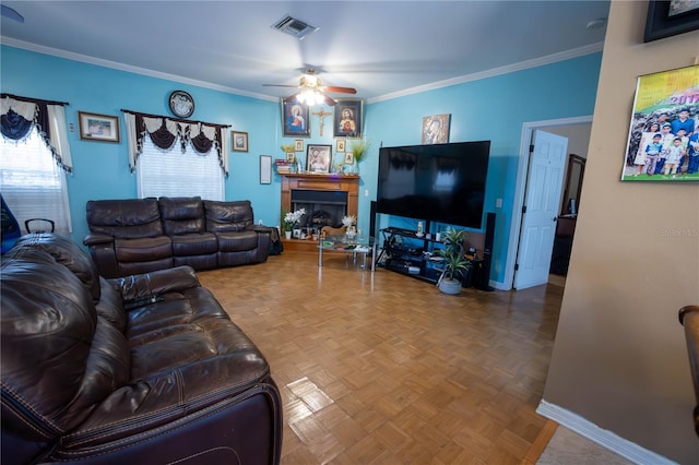 living room featuring ornamental molding, a fireplace, visible vents, and baseboards