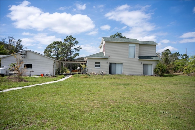 back of house featuring a yard