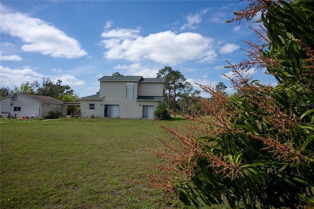 back of house with a yard