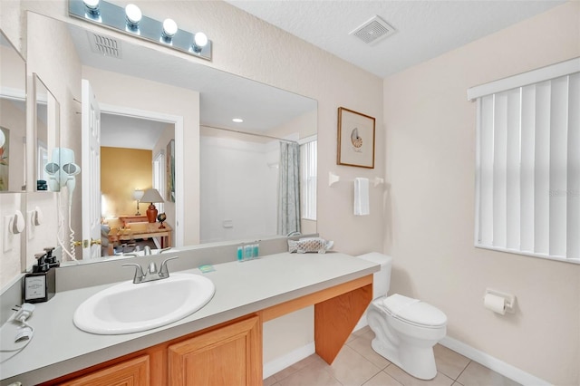 full bath with tile patterned flooring, toilet, vanity, visible vents, and a shower with curtain