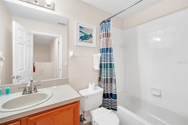 full bathroom with a textured wall, toilet, vanity, visible vents, and shower / bath combo with shower curtain